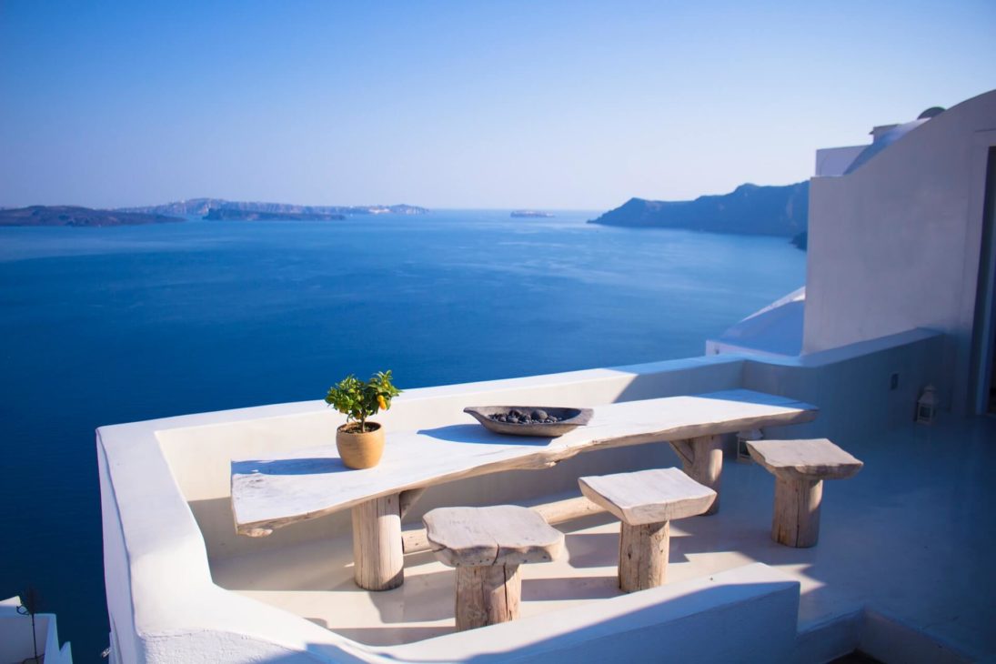 Santorini sea view from white terrace with table