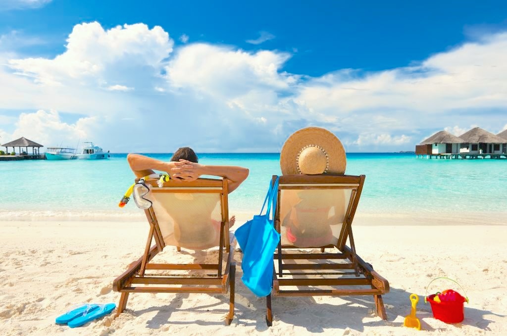 couple on beach chairs on beautiful beach