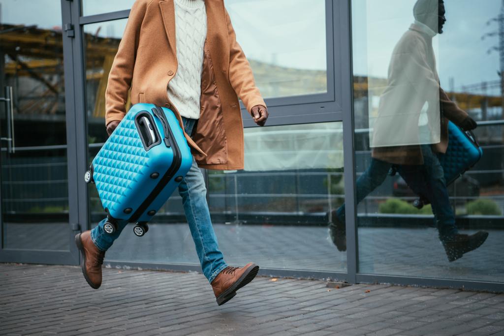 man hurrying at airport